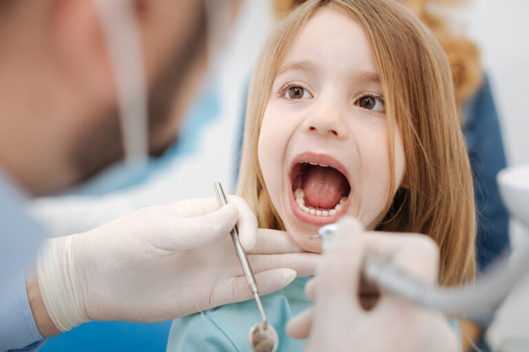 What a sweet kid. Cute lovely nice child behaving nicely and looking unafraid while sitting at the dentists chair